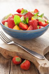 fresh fruit salad with strawberry, apple, nectarine, pomegranate