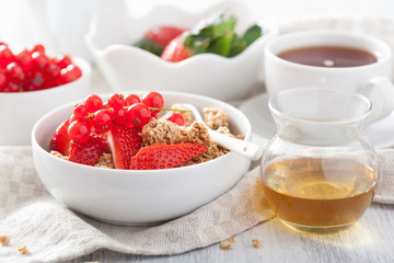 healthy breakfast with granola and strawberry