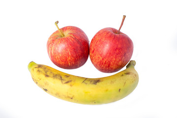 Fresh banana and apples on white background.