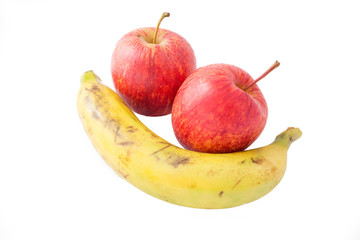 Fresh banana and apples on white background.