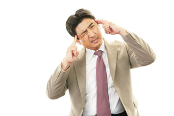 頭痛を訴えるビジネスマン