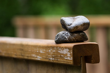 Stones on a wooden railing