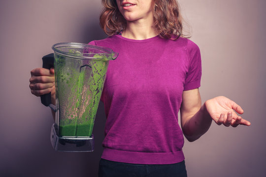 Young woman with green smoothie