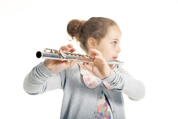 young  girl playing flute © ahavelaar
