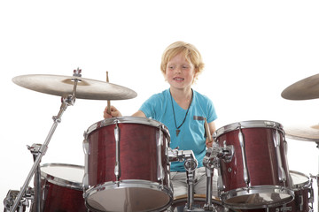 young boy playing drums