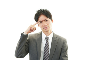 頭痛を訴えるビジネスマン