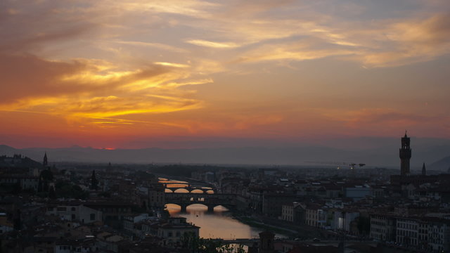 Sunset over bridges through the river Arno in Florence, timelaps
