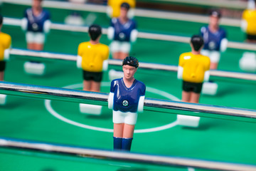 football - board game with players, soccer ball and green field