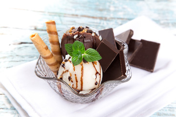 Ice cream scoops on wooden table.