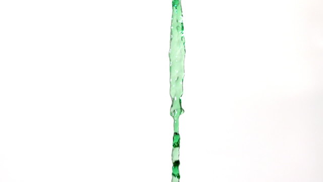 Green water pouring across white background