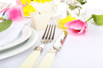 Table setting with spring flowers close up