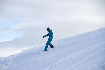 Naklejka na ściany i meble Snowboard freerider in the mountains