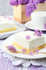 Delicious dessert with lilac flowers