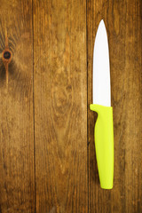 Kitchen knife on wooden table