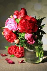 Fototapeta na wymiar Beautiful pink peonies in vase on light background