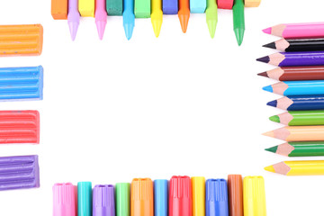 Frame with colorful crayons, plasticine and  chalk pastels,