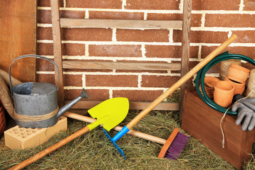 Tools of gardener on  bricks background