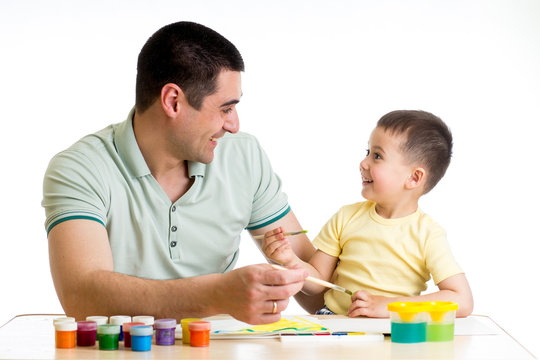 happy kid and dad paint together