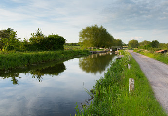 English countryside scene with canal and lock gates