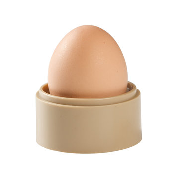 Boiled egg in egg cup ( isolated on white background )