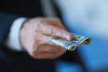 Businessman holding money in his hands
