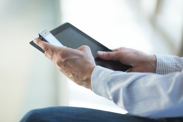man holding digital tablet