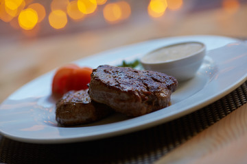 steak with sauce and vegetables