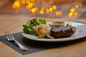 steak with sauce and vegetables