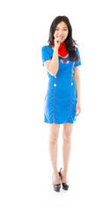 Asian air stewardess with finger in mouth