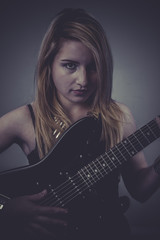 Heavy, Beautiful blonde with black electric guitar