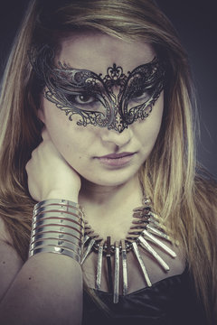 Gold, Beautiful blonde with silver jewelry and mask