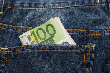 Euro banknotes in jeans back pocket