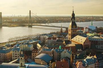 Riga (Latvia)  in the evening.  The view from St.Peter's Church - obrazy, fototapety, plakaty