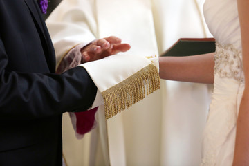 Newlyweds at the catholic church during wedding ceremony