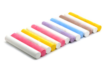 Colored chalks on white background
