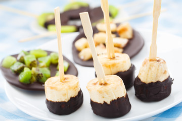Banana with chocolate on a stick