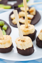 Banana with chocolate on a stick