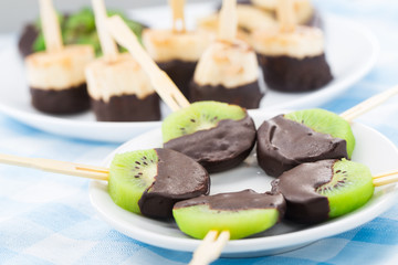 Fruits with chocolate on a stick
