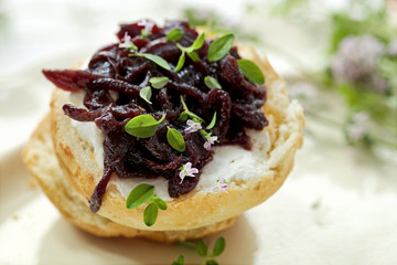 Canape with caramelized onion chutney and goat cheese