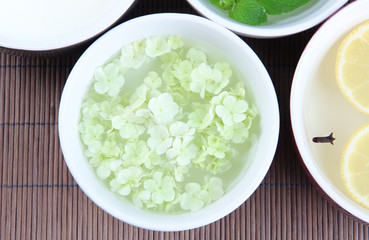 Aromatherapy treatment bowls with flowers and perfumed water