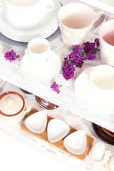 Different tableware on shelf, close up