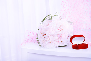 Beautiful wedding composition with bouquet on light background