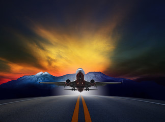 Fototapeta na wymiar jet plane flying over runways against rock mountain and beautifu