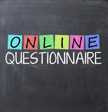 Online questionnaire with adhesive notes on blackboard