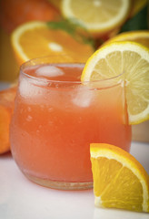 Glass of cold ACE juice,orange, carrot and lemon