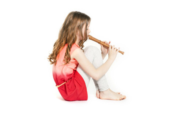 young girl sitting with soprano recorder