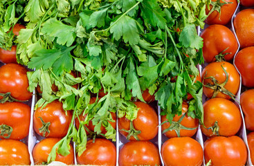 Tomatoes and herbs for sale at a market