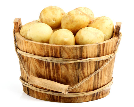 New potatoes in a wooden bucket.