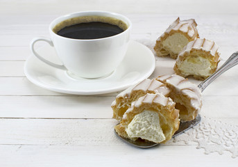 Coffee with cream fancy cake on white