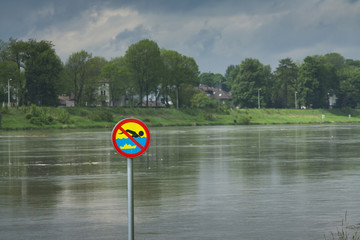 Poland, Kraków, Flood, No Swimming Sign over the Water